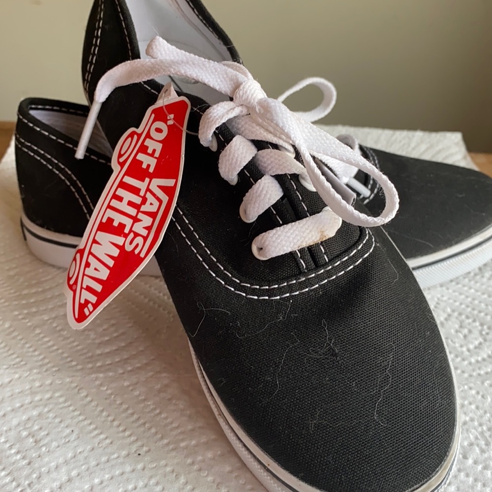 New w/ tags laced pair of black vans. Kid size 3